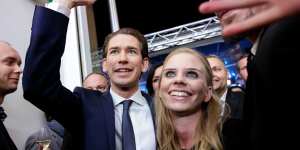 Sebastian Kurz,leader of the People's Party (OeVP),and his girlfriend Susanne Thier celebrate victory in Vienna on Sunday.