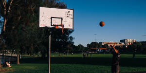 Friends took turn playing basketball in groups of two at Tasker Park in Canterbury.