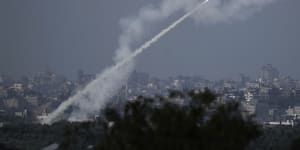 Rockets are fired toward Israel from the Gaza Strip,as seen from southern Israel,Monday,October 16,2023.