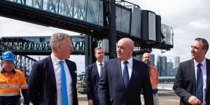 Carnival Australia senior vice-president Peter Little,left,Transport Minister David Elliott and Port Authority chief executive Philip Holliday at the White Bay Cruise Terminal on Monday.