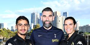 Former Socceroos captain Mile Jedinak (centre),now supporting Ange Postecoglou at Tottenham Hotspur,joined Melbourne Victory players Daniel Arzani and Lydia Williams to promote a three-match series of soccer games that will be played in Melbourne in May.