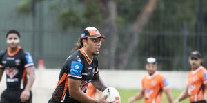 Jarome Luai running the show at Tigers training.