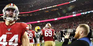 San Francisco 49ers players celebrate after qualifying for the Super Bowl by beating the Green Bay Packers.
