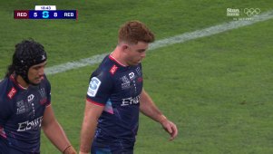 The Reds’ Hunter Paisami copped a yellow card for a swinging arm to Andrew Kellaway’s head as he scored for the Rebels.