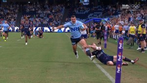 Waratahs star Dylan Pietsch fell agonisingly short of the try line after Carter Gordon chased him down and wrangled his legs into touch, causing Pietsch to spill the ball.