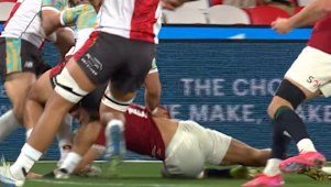 First Nations and Pasifika XV winger Triston Reilly is yellow carded for high contact on Lions opposite Darcy Graham.