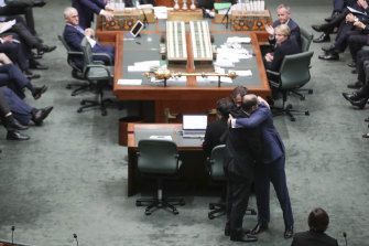 The image of Josh Frydenberg and Ed Husic embracing in Parliament was shared widely on social media. 