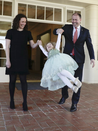 Treasurer Josh Frydenberg with wife Amie and daughter Gemma after his swearing-in at Government House.
