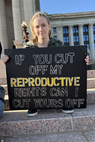 A pro-choice student holds up a sign in Oklahoma.