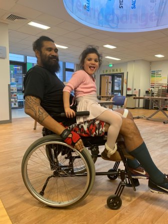 Masoe with his daughter during his recovery in hospital.