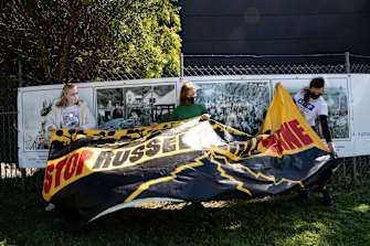 Climate change activists (from left) Naia Webb, Claire Rogers, and Tatianna Hatzopoulos, outside Russell Vale colliery near Wollongong, which has received approval to expand underground mining. 
