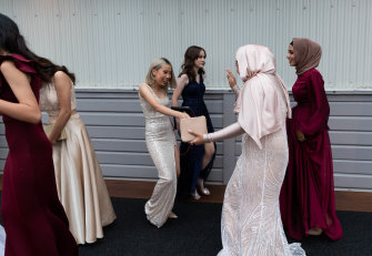 Students greet each other outside the Strathfield Girls High School formal. 