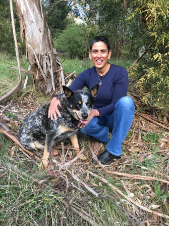 Madhu Tamilarasan (with her dog Dusty) booked a flight to visit her parents in London the same day Scott Morrison said he would soon reopen Australia’s international border. 