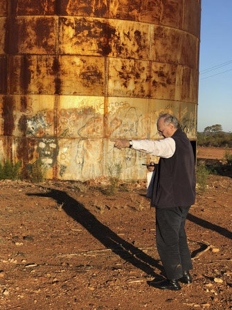 Architect Glenn Murcutt outside the 10-metre-high water tank that is now the Sound Chapel in Cobar, western NSW.