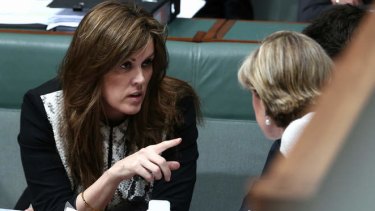 Peta Credlin, chief of staff to the Prime Minister, and Foreign Affairs Minister Julie Bishop in discussion during QT. Photo: Alex Ellinghausen