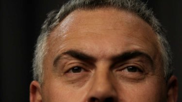 Phew. The mining tax sweat is over. Treasurer Joe Hockey addresses the media during a joint press conference on Tuesday. Photo: Alex Ellinghausen