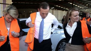 Deputy Opposition Leader Julie Bishop, Opposition Leader Tony Abbott and Liberal candidate Fiona Scott during a visit to a door manufacturer in Western Sydney