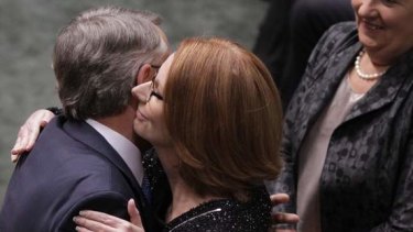 Prime Minister Julia Gillard embraces Treasurer Wayne Swan after he delivered his 2013 budget