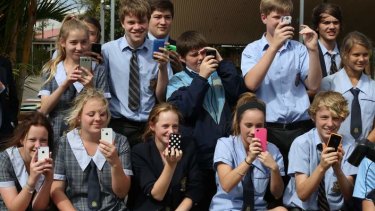 Students watch Labor leader Kevin Rudd during his visit to St Columban's College in Caboolture on Monday.