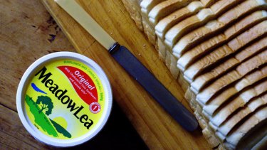A tub of Meadow Lea margarine , slice loaf of bread