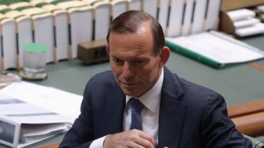 Prime Minister Tony Abbott packs up after question time on Tuesday. Photo: Andrew Meares