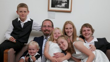 AMEP Senator Ricky Muir and partner Kerrie-Anne, together with their five children (L-R) William, Tristan, Tarja, Phoenix and Dylan in his office in Canberra on Thursday.