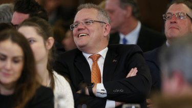 Treasurer Scott Morrison listens to Prime Minister Malcolm Turnbull  in Canberra on Thursday.