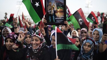 Women in Tripoli celebrate the news of Muammar Gaddafi's capture and death in the town of Sirt in October 2011.