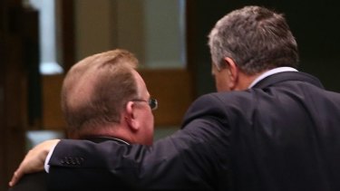 Small Business Minister Bruce Bilson and Treasurer Joe Hockey depart question time on Wednesday.