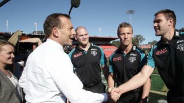 Opposition leader Tony Abbott meets with Penrith Panthers players, in Penrith, NSW, on Tuesday.