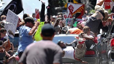 The permit for the Charlottesville, Virginia rally claimed 'free speech.' People fly into the air as a vehicle drives into a group of protesters demonstrating against a white nationalists in August.