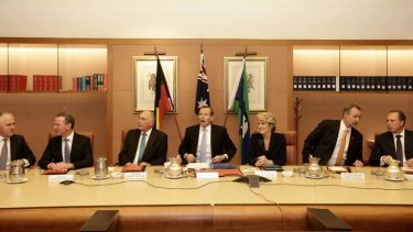 Prime Minister Tony Abbott meets with his ministry in the cabinet room at Parliament House on Wednesday.