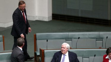 Leader of the House Christopher Pyne, opposition infrastructure and transport spokesman Anthony Albanese and Palmer United Party leader Clive Palmer in discussion during question time. Photo: Alex Ellinghausen