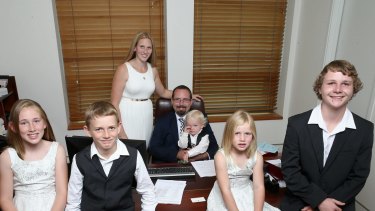 AMEP Senator Ricky Muir and partner Kerrie-Anne, together with their five children (L-R) Phoenix, William, Tristan, Tarja and Dylan in his office ahead of his first speech to the Senate, at Parliament House in Canberra on Thursday.