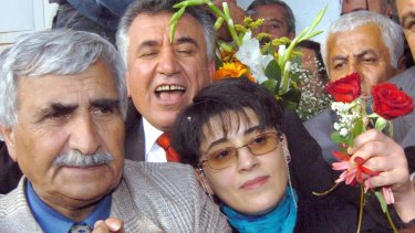 Leyla Zana, right, and fellow MP Selim Sadak are greeted by supporters in Ankara in 2004 after a decade in jail.