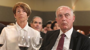 Margie Abbott and Deputy Prime Minister Warren Truss listen as Prime Minister Tony Abbott addresses the National Press Club in Canberra on Monday.
