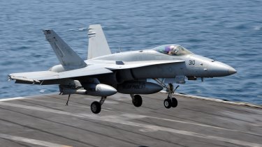 The US military is strong - but there are limits to what it can achieve in the Middle East. Pictured: an FA-18C Hornet lands on the USS George H.W. Bush.