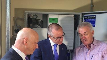 SA Premier Jay Weatherill, AGL CEO Andy Vesey and homeowner Geoff Perkins. 