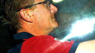 Under the pump: Mark Neeld drives away from the MCG.