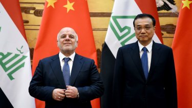 Iraqi Prime Minister Haider al-Abadi (left) with Chinese Premier Li Keqiang in Beijing's Great Hall of the People on Tuesday.