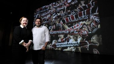 Immersive: Lisa Havilah and artist Khaled Sabsabi with his video work featuring Western Sydney Wanderers fans.