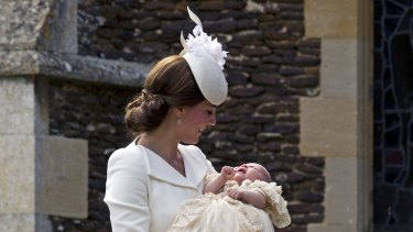 Proud mum Kate with baby Charlotte outside the church. 