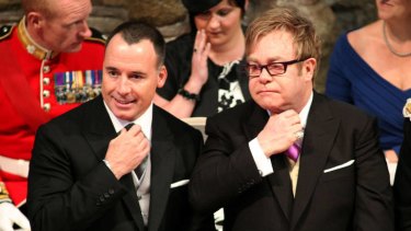 Title in the wings ... Sir Elton John, right, with his partner, David Furnish, at the royal wedding last year.