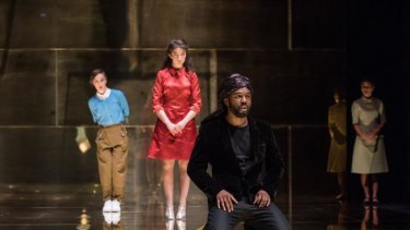 Patsy Ferran (in red) as Portia and Ken Nwosu as Gratiano (front) in the Royal Shakespeare Company's <i>Merchant of Venice</i>.