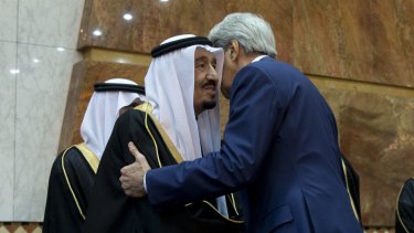 No time for snow shovelling: Secretary of State John Kerry, right, greets new Saudi Arabian King, Salman bin Abdul Aziz in Riyadh, Saudi Arabia.