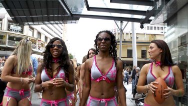 Half-time diversion ... Lingerie Football League players tour Brisbane yesterday. They play in Sydney next weekend.