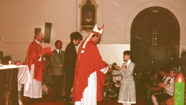 Emma Foster receiving her confirmation certificate from then Bishop George Pell at Sacred Heart Church in Oakleigh, Melbourne, in 1993. Emma died from a drug overdose in 2008. 