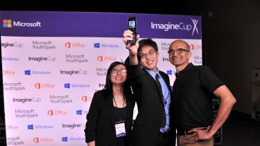 Jarrel Seah and Jennifer Tang are pictured with Microsoft CEO Satya Nadella at the Imagine Cup.