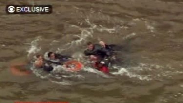 In this frame grab image taken from WCBS-TV, survivors are pulled ashore by rescue workers.