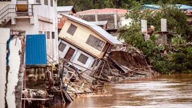 Houses fell into the Matanikau River as a result of the flooding.